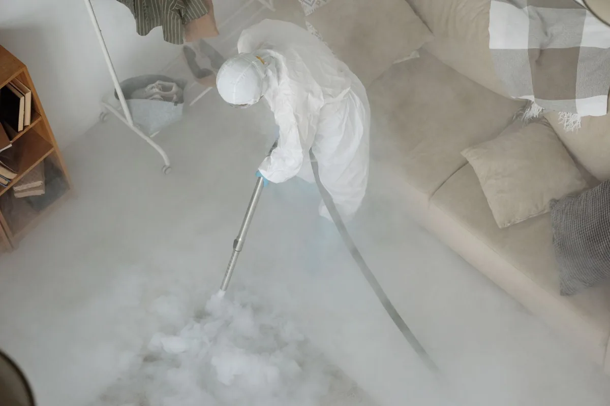 Biohazard cleanup technician in protective equipment, Dublin, PA